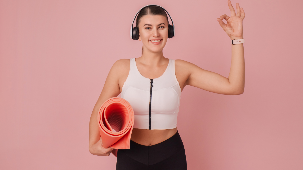 fitness girl holding pink yoga mat to lose weight in a week